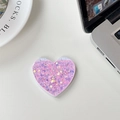 Dettaglio macro di uno specchio da trucco a cuore con glitter viola e paillettes laser - Paillettes Scintillanti Rosa (701562)
