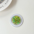 Close-up of holographic green butterfly sequins for nail art in a transparent round case - Laser Green