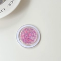 Detail der runden Handyhalterung mit funkelnden lila und rosa Schmetterlings-Pailletten - Nagelpuder