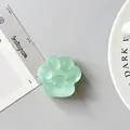 Detailed view of mint green cat paw phone grip with heart relief and frosted finish - Matte Dark Green