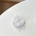 Macro shot of white matte 3D flower phone grip with crystal bead center detail - Magnetic Camellia / White