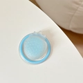 Close-up of a blue translucent 3D strawberry MagSafe phone grip with textured seeds - Magnetic-Sandwich Strawberry-Blue