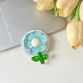 Vue macro d'un support MagSafe en forme de fleur bleue sur un ordinateur portable - Magnétique-Fleur de Cristal à Feuilles Vertes-Bleu