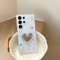 Detail of blue glitter phone case with silver heart mirror and colorful rhinestones - Heart Mirror / Samsung A14