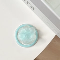 Detail of mint green cat paw phone grip with a heart relief on white background - Light Green