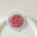 Close-up of pink translucent lip mask with dried flowers in a minimalist round jar - Magnetic Morandi Ink Splash Dark Pink