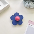 Detailed view of dark blue leather flower phone grip with a pink glossy bead center - (Clear Stand) 3D Leather Flower - Royal Blue