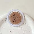 Macro shot of minimalist MagSafe phone grip with pink glitter and black speckle texture - Magnetic Morandi Ink Splash Coffee