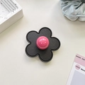 Detail of flower shaped phone grip with black leather texture and pink centerpiece - (Clear Stand) 3D Leather Flower - Black