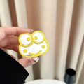 Detail of yellow cartoon frog phone grip with integrated mirror for handheld use - Yellow