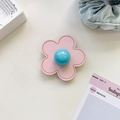 Detail of pink leather flower phone grip with blue glossy center and white stitching - (Clear Stand) 3D Leather Flower - Light Pink
