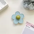 Detail of light blue leather flower phone grip with central green bead and fine stitching - (Clear Stand) 3D Leather Flower - Light Blue