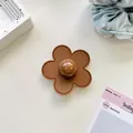 Macro detail of brown leather flower phone grip with stitching and center bead - (Clear Stand) 3D Leather Flower - Brown