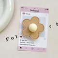 Detailed view of camel leather flower phone grip with stitching and creamy bead center - (Magnetic) 3D Leather Flower - Khaki