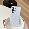 Detail of 3D white bowknots and glitter on light blue semi-transparent Samsung case - Ultra Thin Glitter Drip Glue Mini Bow / White / Samsung A14