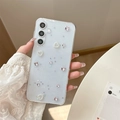 Close-up of light blue glitter phone case with pearl heart and purple metal butterfly - Rhinestone Bow Heart - Pink / Samsung A14
