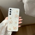 Custodia trasparente con farfalla glitterata e camelia per Samsung S23 Ultra S24 S25 - Ultrasottile Bianco Glitter Epossidico Bordo Dorato Rosa Farfalla / Bianco / Samsung A14