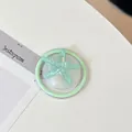 Macro detail of mint green starfish phone grip with glitter resin and magnetic base - Magnetic Round Pearlescent Starfish / Green