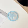 Macro shot of blue glitter starfish phone socket with shell inlay on white background - Magnetic Round Pearlescent Starfish / Blue