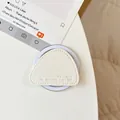 Detail of cream leather magnetic phone grip with lychee texture and mountain quote - White