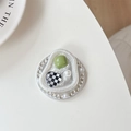 Close-up of heart phone grip with rhinestones, green gem, and pearls on a white surface - Checkerboard Heart (Rhinestone/Magnetic)