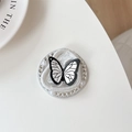 Detailed view of phone socket featuring a butterfly motif with rhinestones and pearls - Black Line Butterfly (Rhinestone/Magnetic)