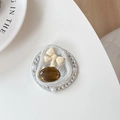 Detail of luxury grip tok with rhinestones, pearls, and a brown oval gemstone - Amber Bow Knot (Rhinestone/Magnetic)