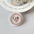Close-up of pink phone grip with sparkling silver heart and radiant crystal inlay - Lava Diamond Heart - Pink