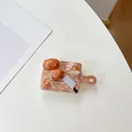 Macro detail of creative resin phone grip featuring a mini cutting board and realistic potatoes - Transparent Stand - Potato Cutting Board