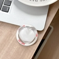 Close-up of heart-shaped phone grip with Good Luck text on a clean desktop - Magnetic Sandwich Heart / White