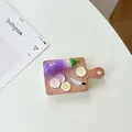 Macro shot of creative eggplant and cutting board telescopic phone grip stand - Transparent Stand - Eggplant Cutting Board