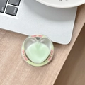 Detail of light green heart-shaped phone grip with Good Luck text on a wooden desk - Magnetic Sandwich Heart / Fruit Green