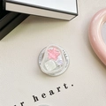 Detailed macro view of heart and star resin charms in a folding mobile phone grip tok - Magnetic Cat-Eye Starfish (Pink)