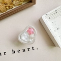 Dettaglio del supporto per telefono a cuore in resina con perle, conchiglie e glitter - Supporto Adesivo - Stella Rosso Rosa