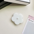 Detailed view of white resin flower phone grip with pearl accent on leather surface - Jelly Magnetic / Pearl White Flower
