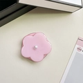 Detailed view of pink flower phone socket with a pearl center on a beige texture - Jelly Magnetic / Pearl Pink Flower