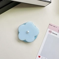 Detail of light blue floral phone grip with a central white pearl on a leather surface - Jelly Magnetic / Pearl Blue Flower