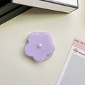 Macro detail of a lavender flower phone grip with a white pearl on a beige leather texture - Jelly Magnetic / Pearl Purple Flower