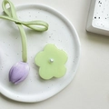 Macro detail of floral phone grip with white pearl center and purple satin tulip ribbon - Transparent Stand / Pearl Green Flower