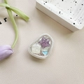 Close-up of heart and star resin phone grip with silver foil on leather background - Adhesive Stand Cat-Eye Starfish (Purple)