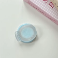 Close-up of a blue telescopic magnetic phone stand with a smiley face design and pull tab - Blue