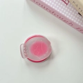 Detail of pink translucent expandable phone grip with cute smiling cartoon character - Rose Red