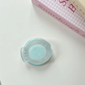 Top view of a mint green round phone grip with a cute cartoon animal embossed on the cover - Light Green