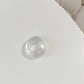 Detailed macro view of the clear crystal glass phone grip with multi-layer ring structure - Clear