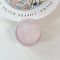 Detailed view of pink apple-shaped phone grip on a white surface with decorative ceramic plate - (Dopamine) Magnetic-Sandwich Apple-Pink