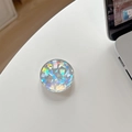 Macro detail of round crystal glass phone socket with holographic geometric pattern - Holographic