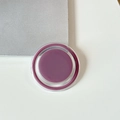 Detail view of magnetic phone grip showing berry purple paste and transparent casing - Mauve