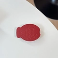 Detail of red fish-shaped leather phone grip with lychee grain and fine stitching - Leather Taiyaki / Burgundy