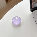 Close-up of lavender crystal glass phone socket stand on white desk near a laptop - Light Purple