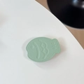 Detail of mint green fish leather phone grip with soft texture and stitching - Leather Taiyaki / Green